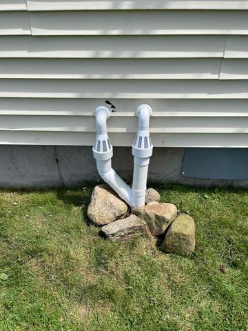 The IceGuards were installed outside where the discharge line begins so that water can escape the pipes if the whole line freezes during cold temperatures!