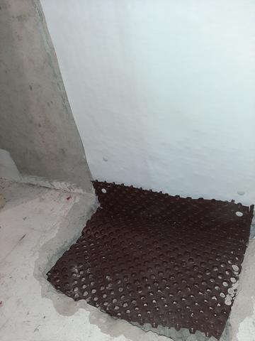 A drainage membrane is added to the floor to insure that any possible moisture gets directed under the floor slab.