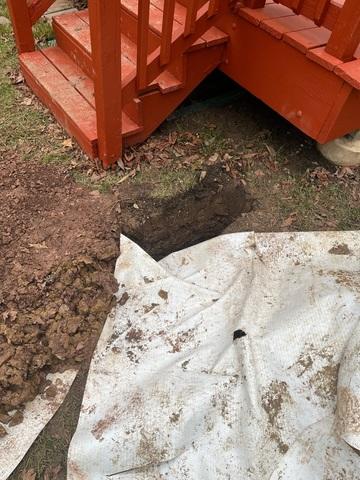 Here is a view of where the wall anchor connects to.  There is an earth plate that is installed under ground and the wall anchor has a steel rod underground that connects both plates.