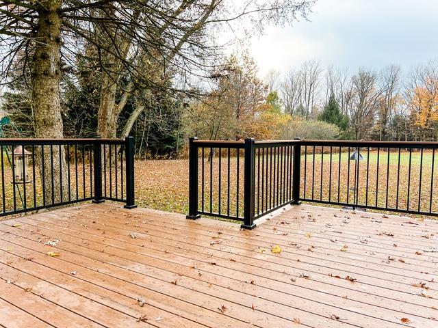 Black aluminum railings from Craftbilt are sturdy and weather resistant. Composite decking is nice as well, it lasts a long time in weather as well and there's no need for refinishing unlike traditional deck boards.