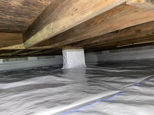 The vapor barrier is sealed to the walls and piers to keep out water and humid air. The crawl space vents are sealed with Foamax insulation as well to keep humid air out.