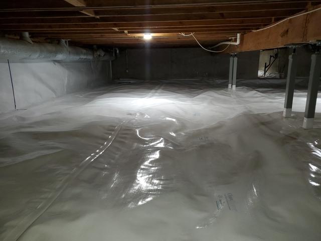 CleanSpace liner on top of dimpled membrane & walls of crawl space