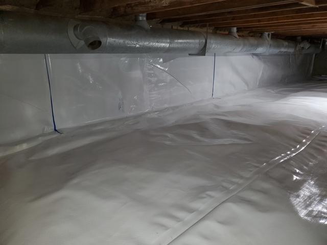 CleanSpace liner on top of dimpled membrane & walls of crawl space