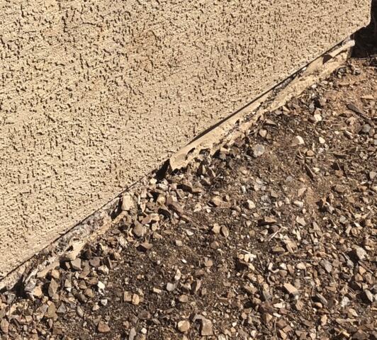 Symptoms of Corrosion Problems in a Stem Wall: Spalling Concrete