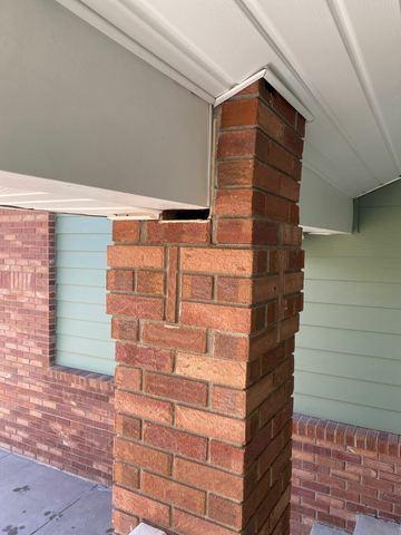 Gap between brick column supporting deck