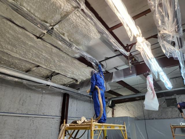 Our team making progress on insulating the ceiling.