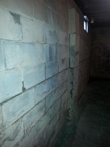 Here you can see a closer view of the bowed walls. Do you have bowing, slanted, uneven walls in your basement? Give us a ring to get it checked out.