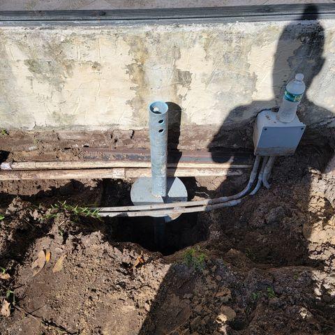 Helical Pier Installation Near Pool Deck