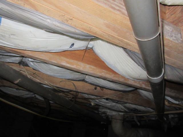 Bunched up insulation with wire hangers