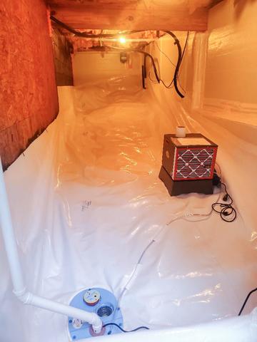 With a CleanSpace Encapsulation System, this space is protected from moisture & humidity. The SaniDry Sedona Dehumidifier on the right is able to monitor the humidity of the air and pull out moisture as needed, draining it into the sump pump on the left, which removes the water from the crawl space.