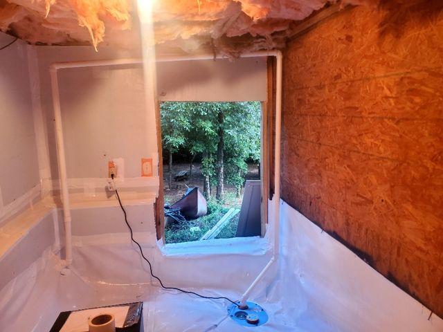 The walls were sealed with Foamax wall barrier and a CleanSpace vapor barrier to seal out humid air and flooding groundwater.