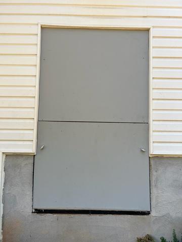 This is the newly installed crawl space door designed to keep out moisture.