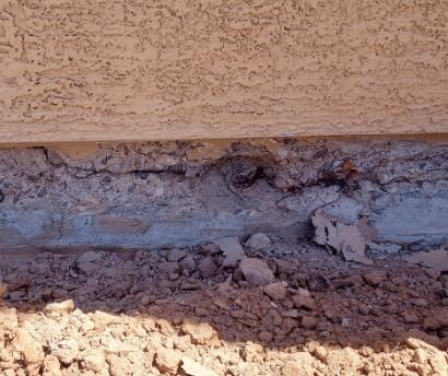 Signs of Corrosion in a Stem Wall: Spalling Concrete