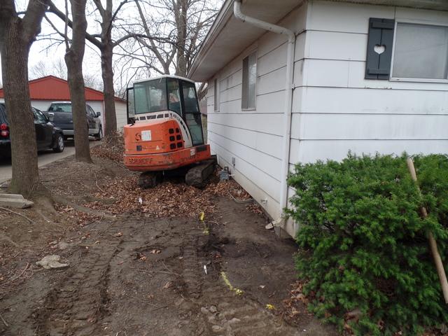 Excavating for wall replacement to access the footing and demo the wall is a big job that requires heavy machinery. 