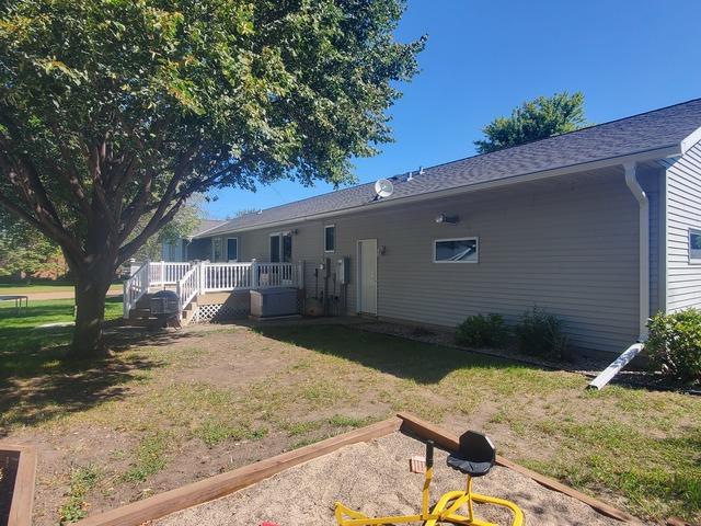 The back side of the home required another 70 foot run of Gutter Shutter with a downspout at each end. The near downspout shows our tip-up design in its lowered position.