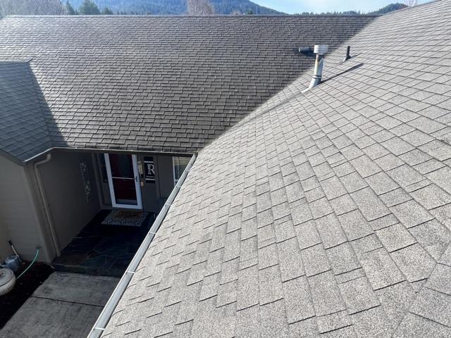 This photo showcases the new roof and gutter systems.