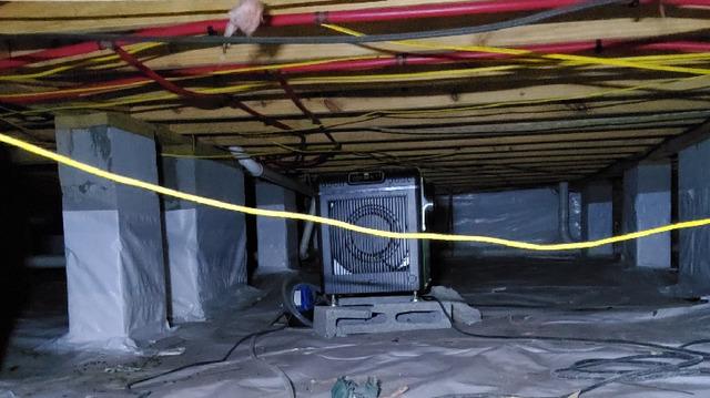 This crawl space had moisture issues as a result of being improperly sealed with a cheap thin plastic vapor barrier. Here is the first of 3 failing dehumidifiers in this crawl space.