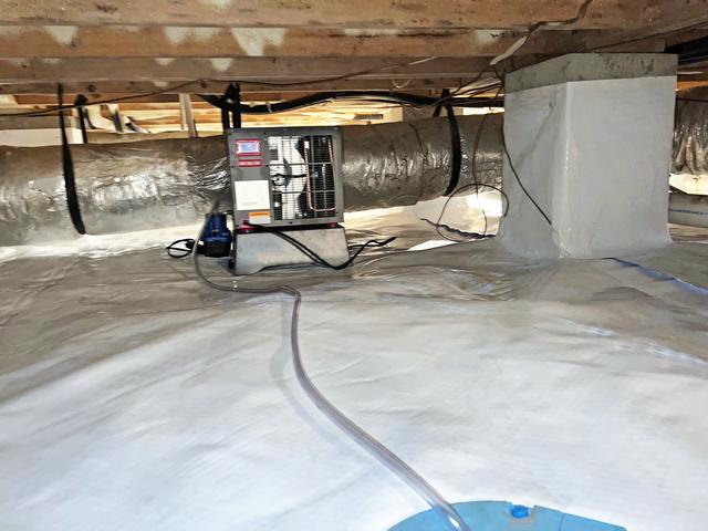 A SaniDry Sedona dehumidifier is installed to monitor and control the humidity level in the crawl space with high energy efficiency.