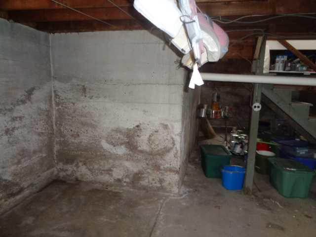 Even if there are no puddles on the floor, water can still be a problem for a basement. To stop this humidity from causing further damage in this basement, we installed our SaniDry dehumidifier. It can pump 110 pints of water per day out of the basement, and its air filter can remove particles from the air as small as 2 microns. 