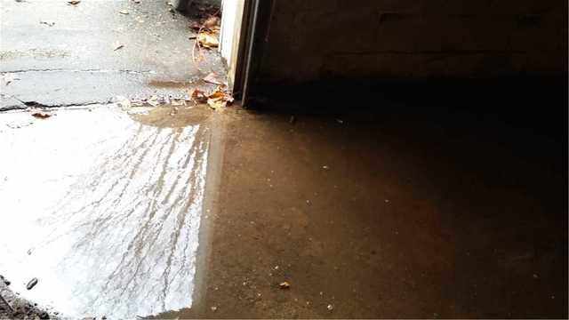 This flooded doorway in Bethel, CT is a perfect example of the importance of waterproofing your entranceways.