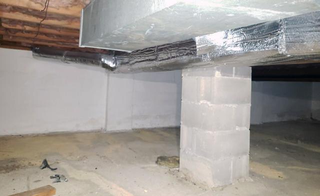 Homeowner's crawl space without any insulation on the foundational walls.  Cold and hot air will seep into the concrete walls into the crawl space without any insulation to stop it.