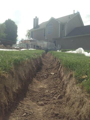 Here you can see the trench that we dug for the discharge line. We made sure the line has pitch to allow the water to flow away from the home.