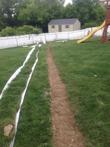 Here you can see we placed the pipe and backfilled, all that is left is replacing the grass and raking the dirt out of the yard. 