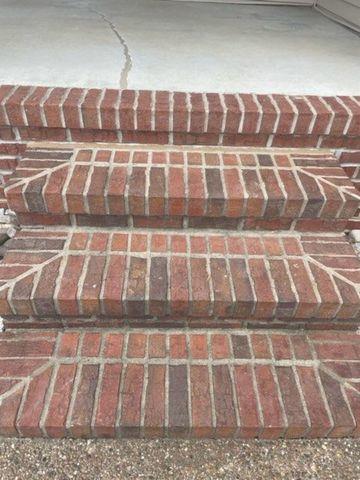 Front steps lifted and repaired