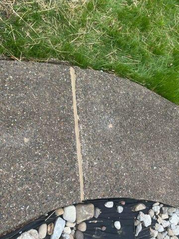 Repaired crack on front sidewalk