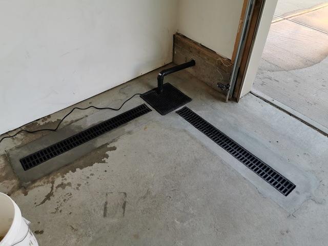 TrenchDrain grated drain pipe and sump pump