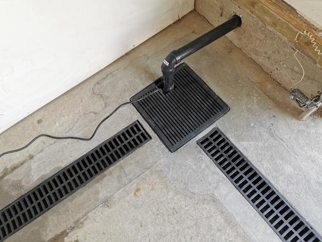 TrenchDrain grated drain pipe and sump pump