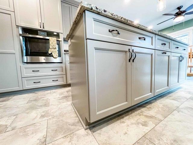 Nice tan light sandy colored flooring was installed going along with the color theme of the kitchen. This kitchen island also has large base cabinets perfect for maximizing the space and creating more storage.