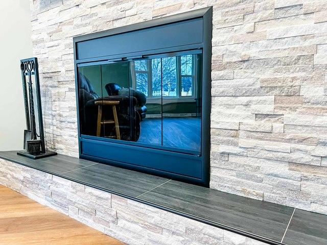 Another nice finishing touch to this fireplace is the nice black tile ledge!