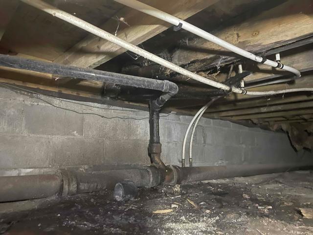 In this photo, you can see the rotten wood joists in an area where there was a plumbing leak in the crawl space of a Warner Robins, GA home. The damage to the wood contributed to the reason why the floor became uneven and resulted in cracks in the drywall.