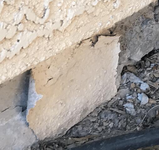 Signs of Corrosion in a Stem Wall: Spalling Concrete