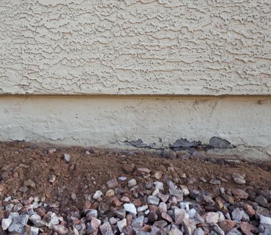 Signs of Failure in a Concrete Stem Wall: Flaking Paint