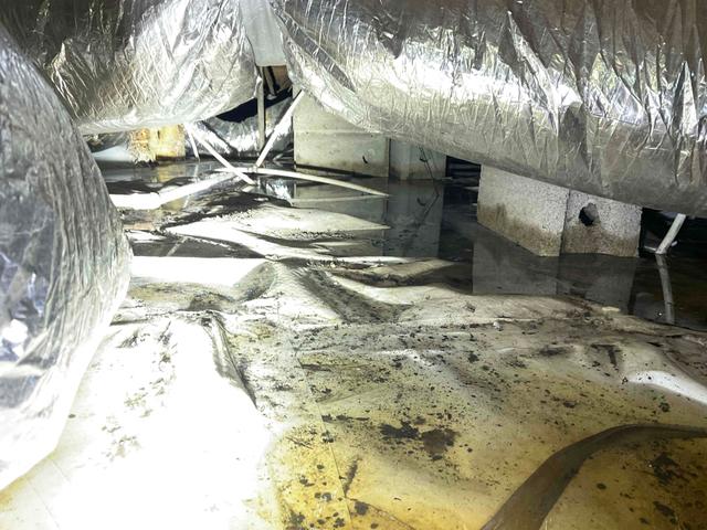 Flooded Crawl Space with Water on Vapor Barrier Liner