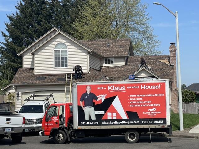 A shot of our crew installing the new shingles.