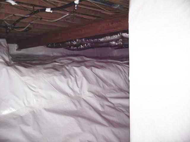 With a vapor barrier installed in this crawl space, all those moisture-related problems such as rot, mold, foul odors and insects may be gone for good.