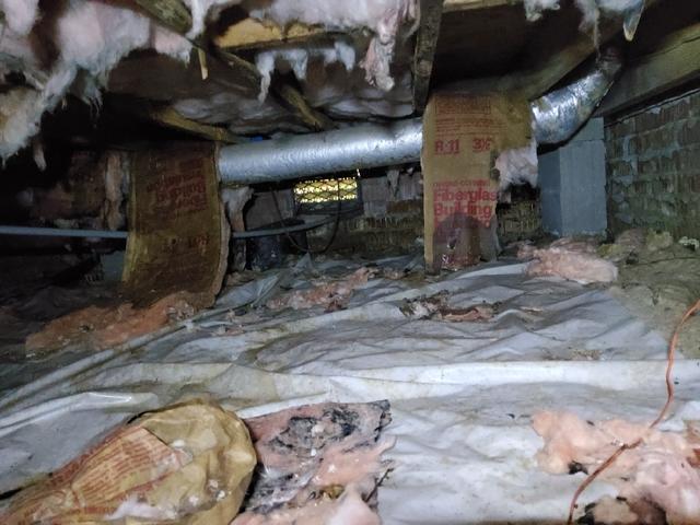 Messy Crawl Space With Falling Insulation
