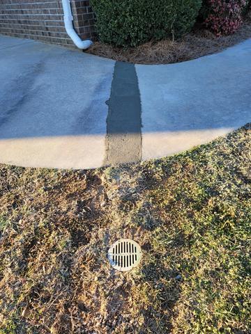 Buried Downspout Completion with Re-poured Concrete