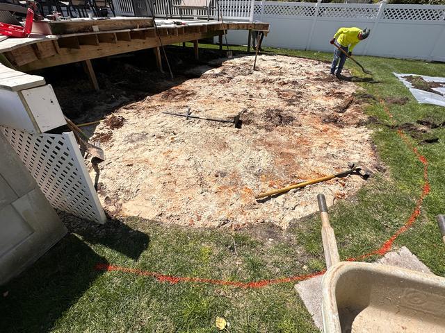 The first step in completing this project was to disassemble and remove the existing pool from the property. Here is a photo of our team hard at work. If you look closely you will see spots of red in the dirt below the pool, that red color is from all the rust that had formed under Cherie's swimming pool!