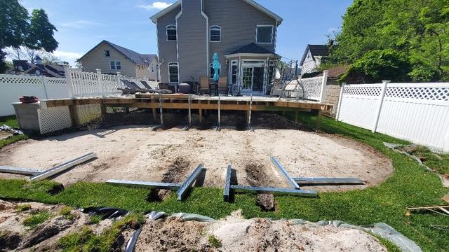 <p>After the site was expanded, our team laid sand and leveled the ground so the pool would rest evenly. They got to work completing the installation process.</p>