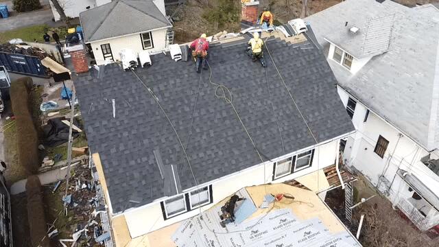 Our team finishing up the upper roof