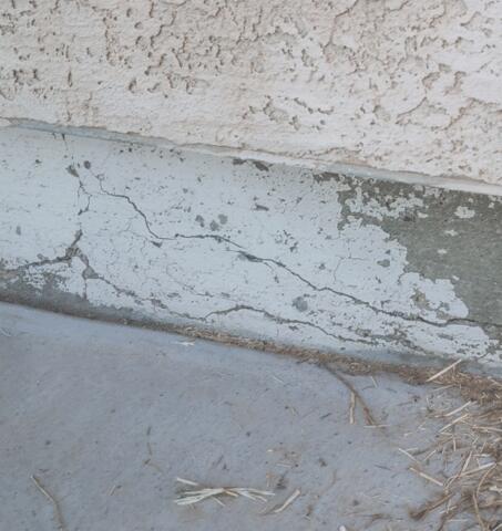 Signs of Corrosion in a Concrete Stem Wall: Flaking Paint