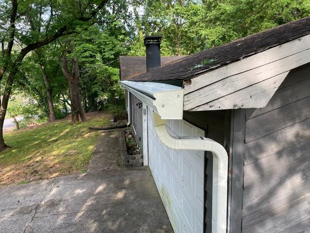 Side view of Gutter Shutter and elbows to direct water away from home in Norcross, GA