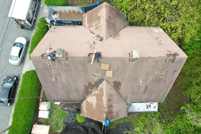 This is another look at the roof before we rip up all the damaged shingles. The front portion of the roof has minimal amounts of algae but the back of the house was covered and you can really see all the black marks left behind by it.