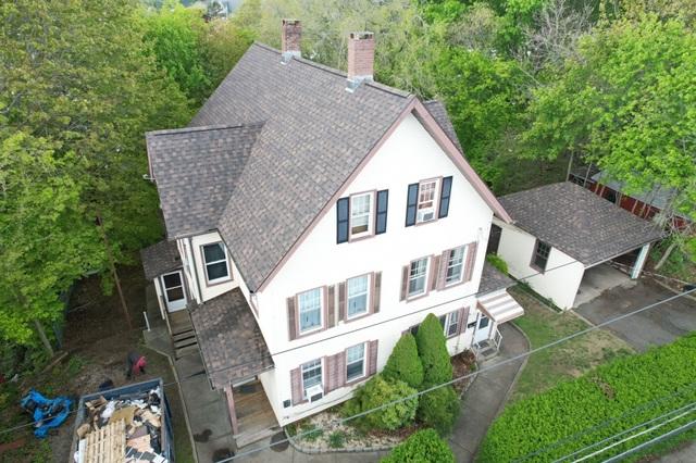 By the end of the second day our team finished the roof and it looks fantastic. The colors perfectly match and having a matching garage that's moss and Algae free adds so much to this house. The Agamy's loved their new roof and were pleased to know that it is guaranteed for the next 50 years!