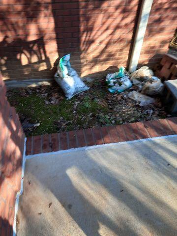 Separation of porch & brick that has been repaired