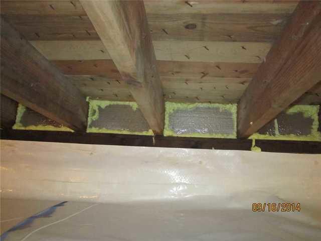 Rim joists, or the area where the wall meets the floor, are often the site of air leaks in a crawlspace. They let unconditioned, humid air into the house and can cause heating and cooling costs to rise. We installed SilverGlo insulation in the rim joists. SilverGlo is an expanded polystyrene foam insulation that's been infused with graphite during its creation to improve its insular ability by 24%, which saves the owners money.